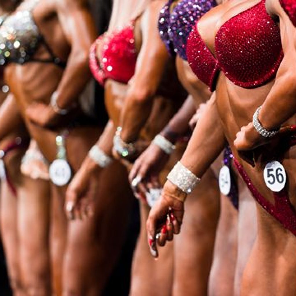 Home 9 Women bodybuilders standing on stage